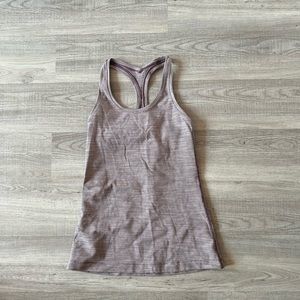 Lululemon purple and white striped tank. Tag removed but barely worn. Size 6.